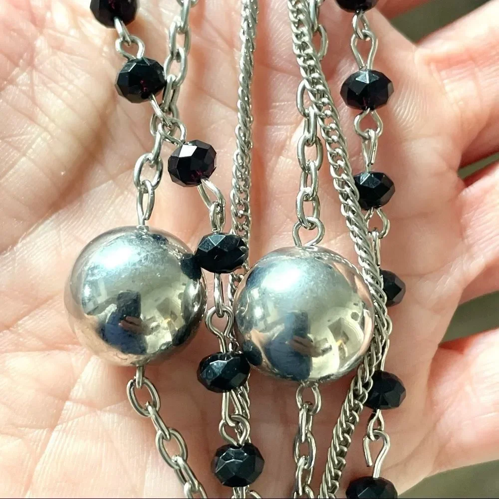 Multi strand silver tone long necklace